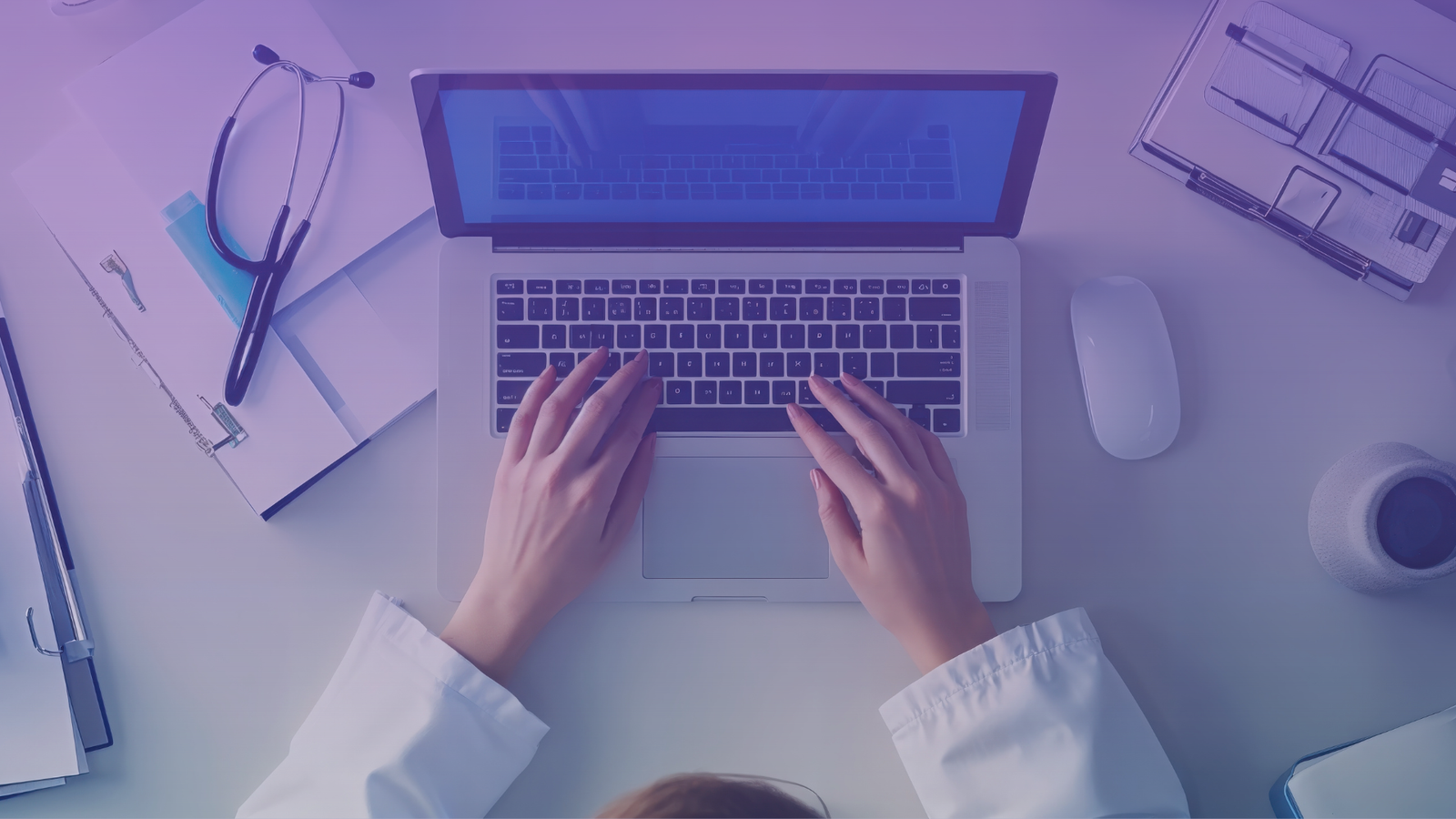 Dr. Maria Zalazar working on menopause education on a computer, representing evidence-based medical guidance